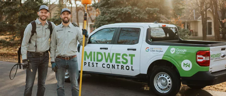 Owners standing next to truck